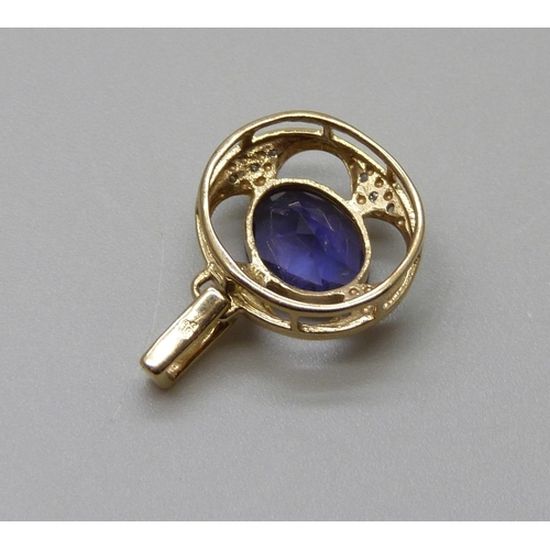 964 - A 9ct gold pendant, set with diamonds and a blue stone, 1.5g, 14mm wide