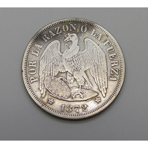 975 - An 1872 Chile one peso coin, Andean Condor with a claw on the shield, .900 silver, 24.7g