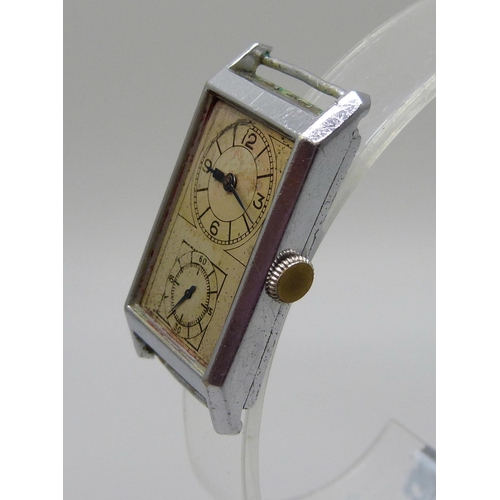 980 - A c1940's dual dial Swiss made wristwatch, 21mm wide case scratched and worn, lacking glass