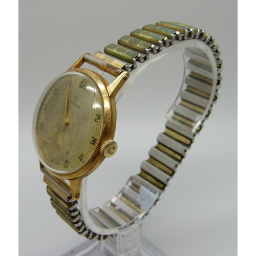 989 - A 1940's 18ct gold cased Omega wristwatch, the case back bears inscription dated 1945, 34mm case