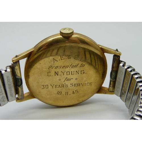 989 - A 1940's 18ct gold cased Omega wristwatch, the case back bears inscription dated 1945, 34mm case