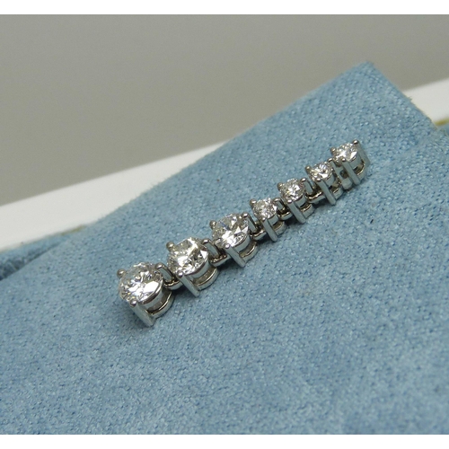 998 - A pair of platinum set diamond drop earrings, each set with seven diamonds, 1.26 carat total diamond... 