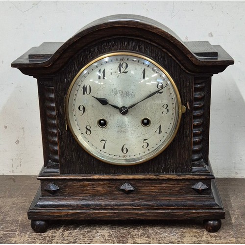 364 - An early 20th Century oak mantel clock