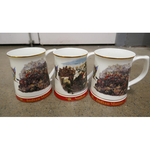 1122 - Two Danbury mint Indian Mutiny mugs, and a Sudan mug