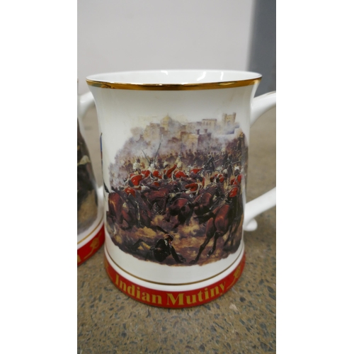 1122 - Two Danbury mint Indian Mutiny mugs, and a Sudan mug