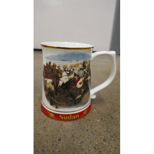 1122 - Two Danbury mint Indian Mutiny mugs, and a Sudan mug