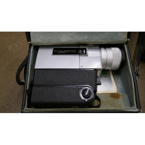 1161 - A Super 8 camera, projector and screen, all boxed **PLEASE NOTE THIS LOT IS NOT ELIGIBLE FOR IN-HOUS... 