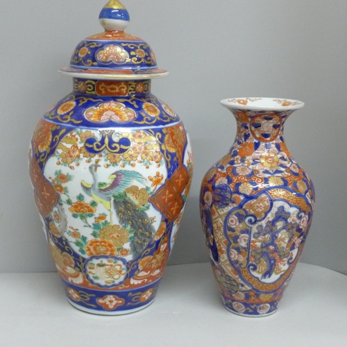 604 - A Japanese Imari vase, 22cm, and an Imari vase and cover