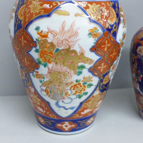 604 - A Japanese Imari vase, 22cm, and an Imari vase and cover