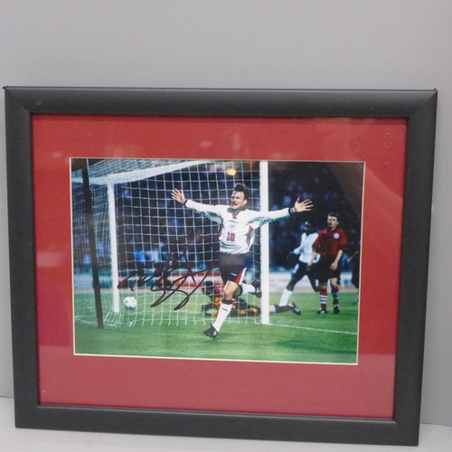 608 - Football, a signed Teddy Sheringham photographic print, framed