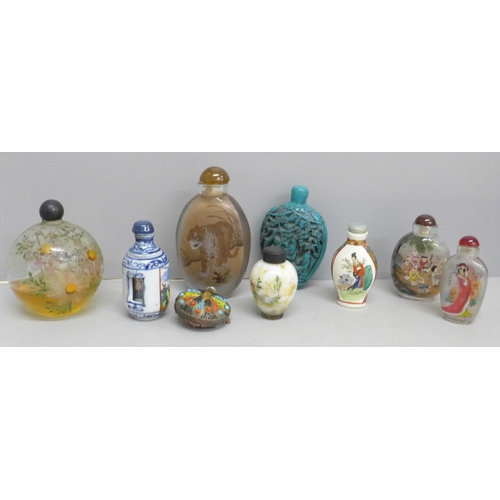 612 - A collection of nine scent bottles