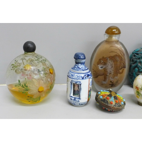 612 - A collection of nine scent bottles