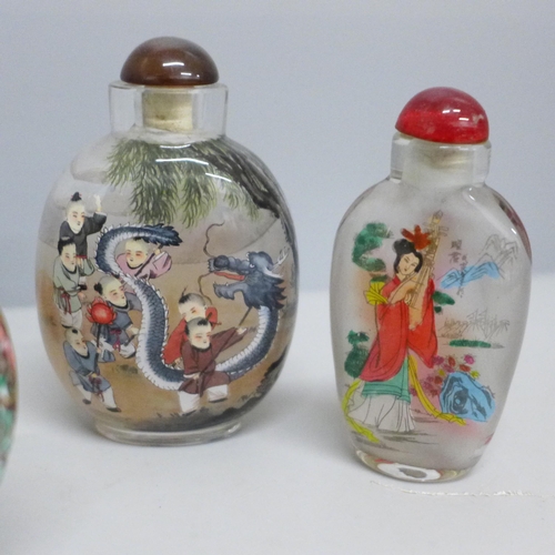 612 - A collection of nine scent bottles