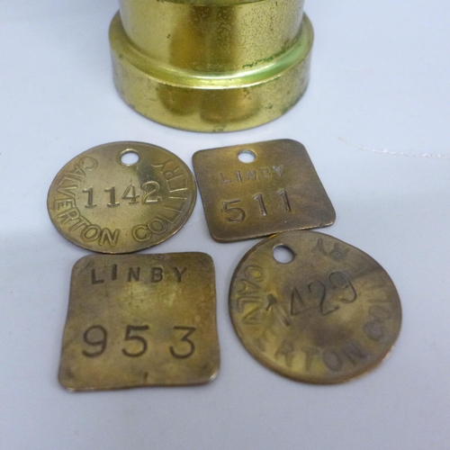 615 - A small miners lamp and four pit checks, two Linby colliery and two Calverton colliery