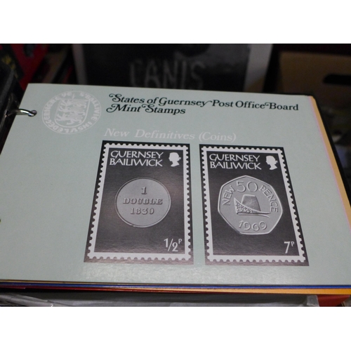 646 - Stamps; a box of Channel Islands presentation packs