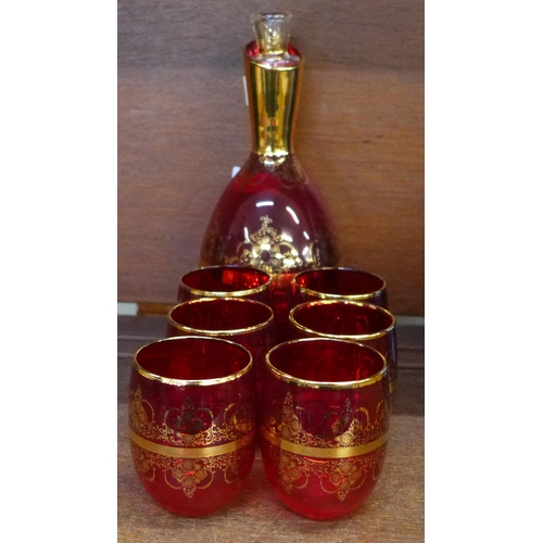 660 - A Ferro Lazzarini Italian Murano glass ruby red decanter set with 24ct gold overlay