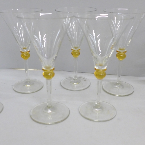 688 - Two sets of six drinking glasses including Babycham