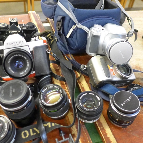 696 - Cameras and camera equipment, Olympus OM-1 x2, OM-2 body, OM 10 body, Ricoh 35 ZF, Praktica BC 1 bod... 