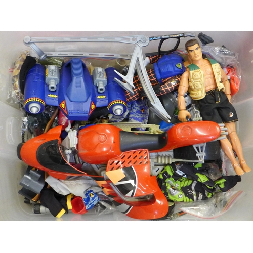 703 - A collection of Action Man figures and an Action Man car, boxed