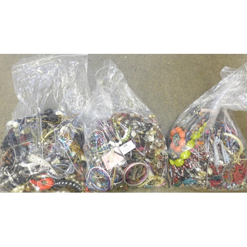 708 - Three bags of costume jewellery