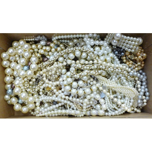 733 - A collection of faux pearl necklets and bracelets