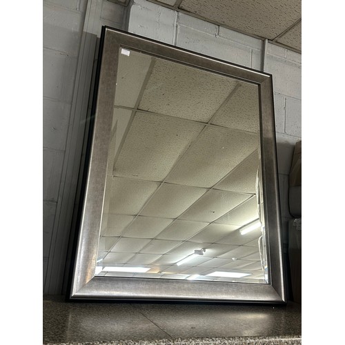 1436 - A silver framed mirror