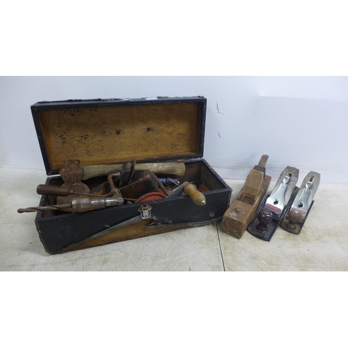 2016 - A Wooden toolbox containing an assortment of hand tools including hand drill, brace drill, hatchet a... 