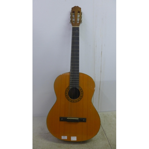 2050 - A Jose Ferrer El Primo 055815 classical acoustic guitar, one other acoustic guitar and a TGI soft gu... 