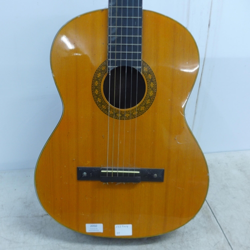 2050 - A Jose Ferrer El Primo 055815 classical acoustic guitar, one other acoustic guitar and a TGI soft gu... 