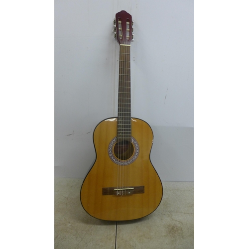 2050 - A Jose Ferrer El Primo 055815 classical acoustic guitar, one other acoustic guitar and a TGI soft gu... 