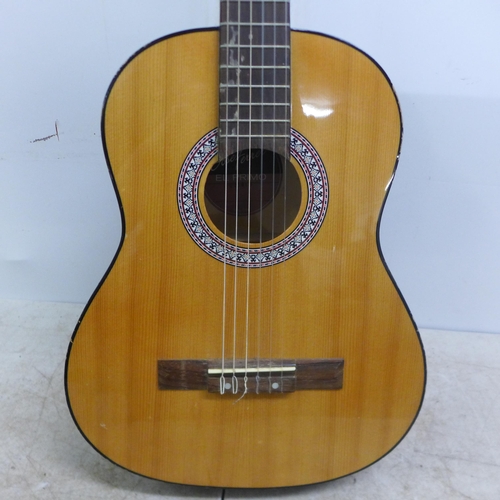 2050 - A Jose Ferrer El Primo 055815 classical acoustic guitar, one other acoustic guitar and a TGI soft gu... 