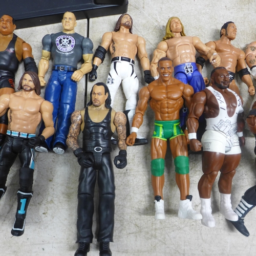 2051 - 19 WWE figures, 2 WWE rings, a Marvel light box and an Ironman poster