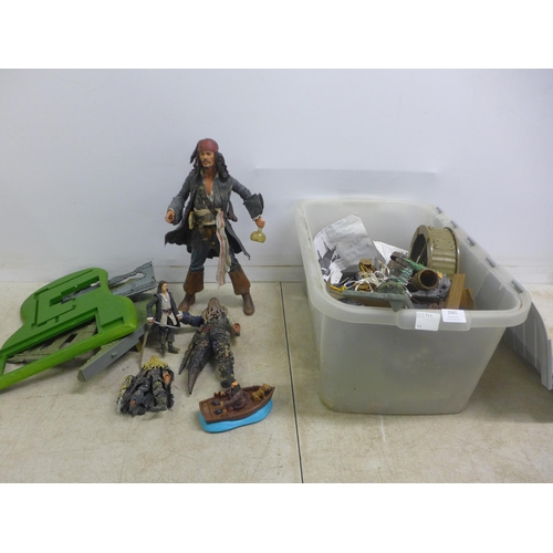 2062 - A large quantity of collectable Pirates of the Caribbean model figurines and other playset items inc... 