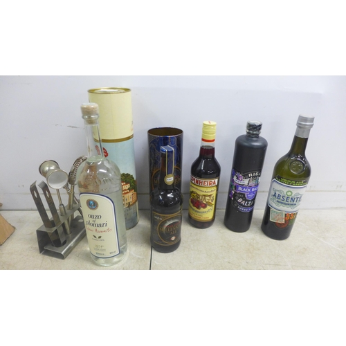 2066 - Five bottles of alcohol including Riga Black Balsam, Ouzo of Plomari and a stainless steel drinks co... 