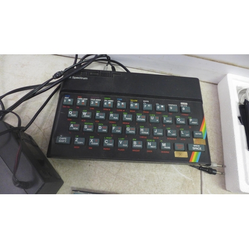 2067 - A Prism VTX500 Sinclair 2X Spectrum, instruction book and games