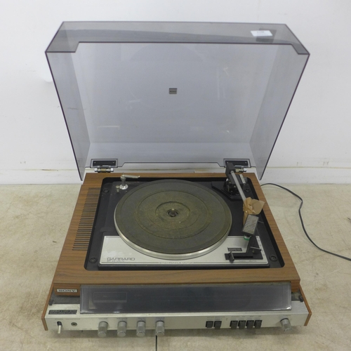 2108 - A Garrard SP 25 MK IV synchronous motor HMP-40 stereo music system with turntable record player and ... 