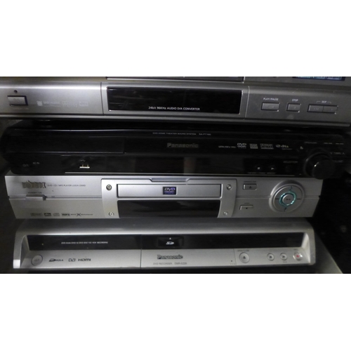 2114 - A quantity of DVD players including Manhattan DVD-200, Panasonic DMR-EZ25, Logix 3300D, Panasonic SA... 