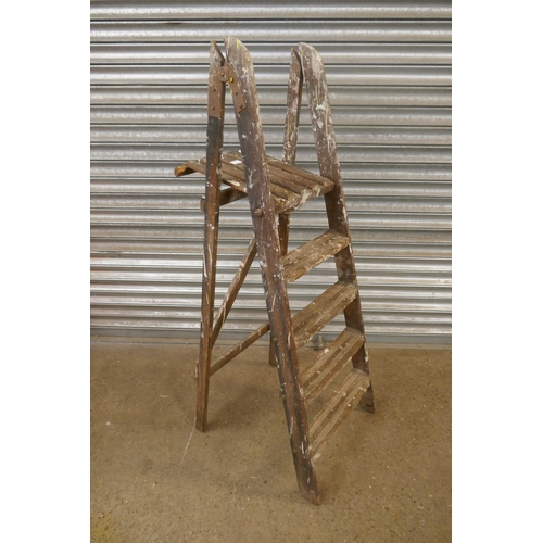 2160 - A set of 6 rung wooden step ladders and a set of 5 rung wooden step ladders