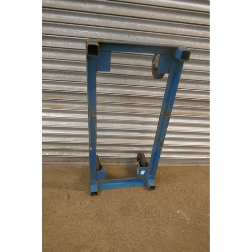 2162 - A large mobile steel frame with rubber tired castors