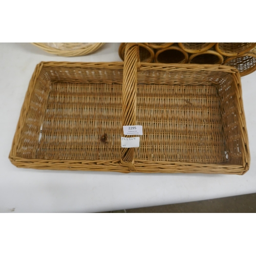 2295 - A selection of wicker items including hamper baskets and a wine rack