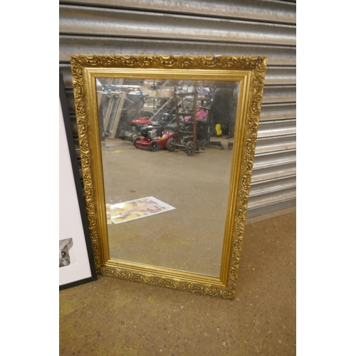 2299 - A gilt effect framed mirror, a vintage railway framed print, a framed copy of The Nottingham Evening... 