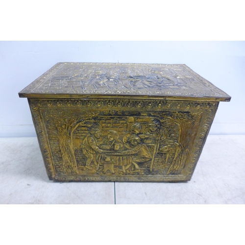 2309 - An ornate brass storage chest, a set of brass and wooden fireplace bellows, two vintage circular equ... 