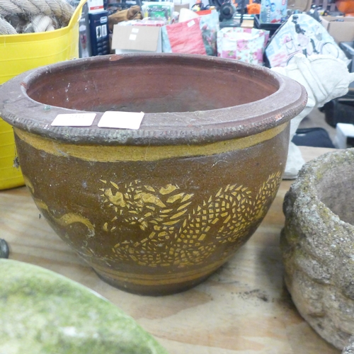 2311 - Two large round plant pots including one stone plant pot and one glazed plant pot with oriental drag... 