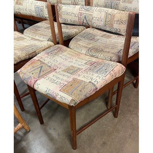 112 - A set of four teak dining chairs and two bamboo magazine racks