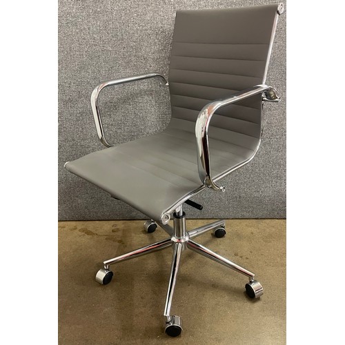 117 - An Eames style grey leather and chrome revolving desk chair