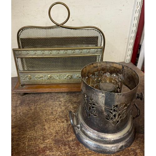 376 - An Edward VII oak and brass newspaper rack and a silver plated plate warmer