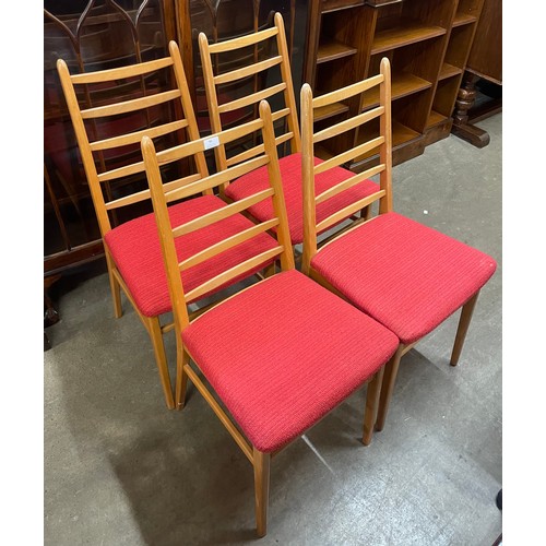 80 - A set of four East German MFI beech and fabric upholstered chairs