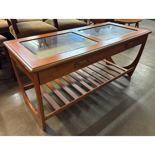 86 - A G-Plan teak and glass topped single drawer rectangular coffee table