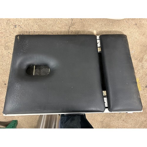 2308 - A black foldable massage table