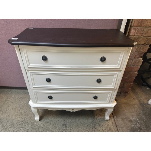 1461 - A white three drawer chest with contrast top